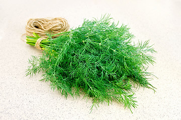 Image showing Dill with twine on granite table