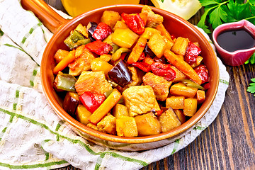 Image showing Roast with vegetables and honey in pan on napkin