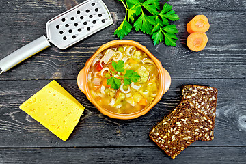 Image showing Soup Minestrone in clay bowl on black board top