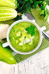 Image showing Soup cucumber with peppers in white bowl on light board top