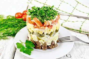 Image showing Salad with beef and tomato on light board