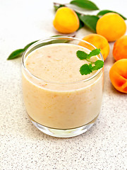 Image showing Milkshake apricot on granite table