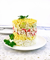 Image showing Salad of crab sticks on napkin