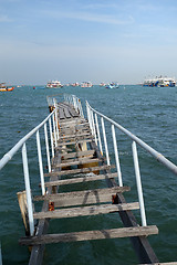 Image showing The wooden bridge extending into the sea