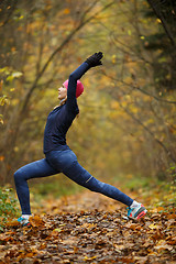 Image showing Young woman on stretching exercises