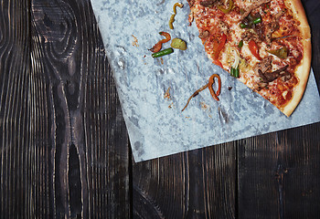 Image showing Homemade pizza on a wooden table