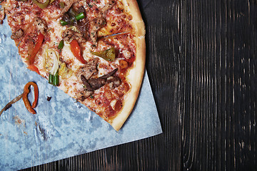 Image showing Homemade pizza on a wooden table