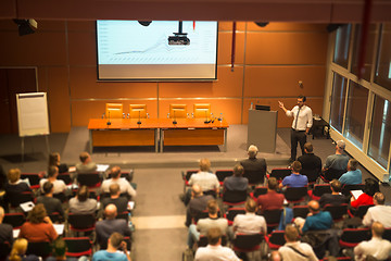 Image showing Business speaker giving a talk in conference hall.