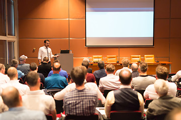 Image showing Business speaker giving a talk in conference hall.