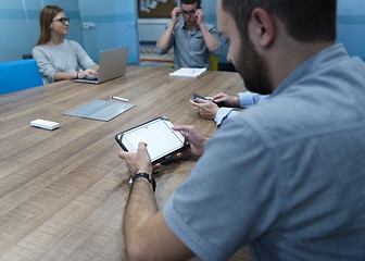 Image showing close up of businessman on meeting using tablet