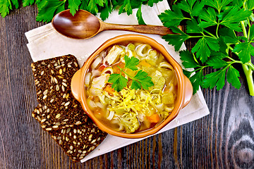 Image showing Soup Minestrone in clay bowl on board top