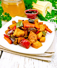 Image showing Roast with vegetables and honey in plate on board