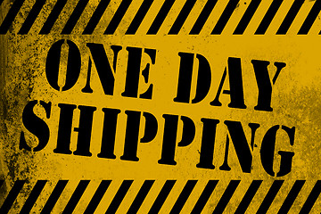 Image showing One day shipping sign yellow with stripes