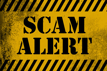 Image showing Scam alert  sign yellow with stripes