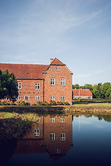 Image showing Castle made of red bricks with reflection