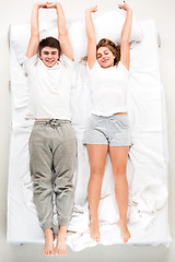 Image showing The young lovely couple lying in a bed