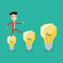 Image showing Businessman jumping on light bulbs.