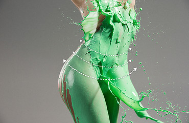 Image showing The beautiful woman with green liquid paint over her body