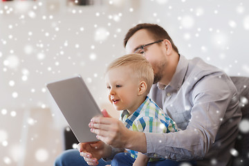 Image showing father and son with tablet pc playing at home