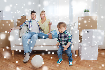 Image showing happy family moving to new home and playing ball