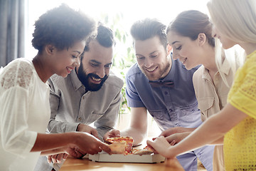 Image showing happy business team eating pizza in office