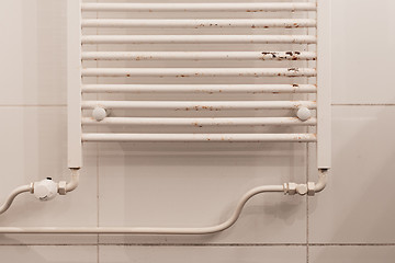 Image showing Rusty household cast iron radiator