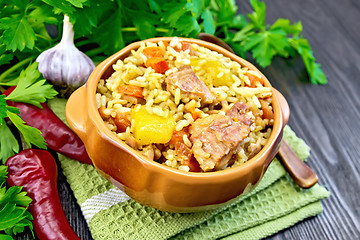 Image showing Rice with chicken and zucchini in bowl on board