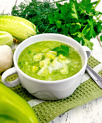 Image showing Soup cucumber with garlic in white bowl on board