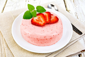 Image showing Panna cotta strawberry with mint on light board