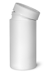 Image showing White plastic bottle for vitamins with lid removed