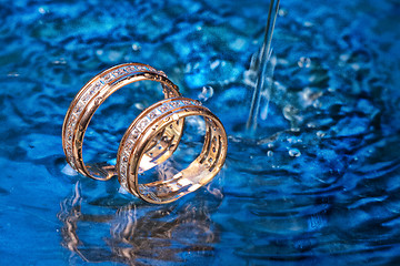 Image showing Golden Rings In The Water