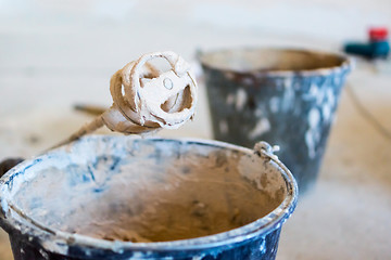 Image showing Construction theme - buckets of cement mixture