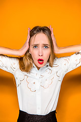 Image showing Portrait of young woman with shocked facial expression