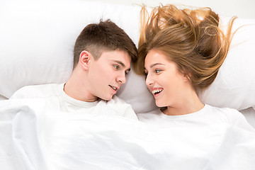 Image showing The young lovely couple lying in a bed