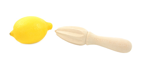 Image showing Whole lemon and wooden citrus reamer