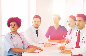 Image showing group of happy doctors on conference at hospital