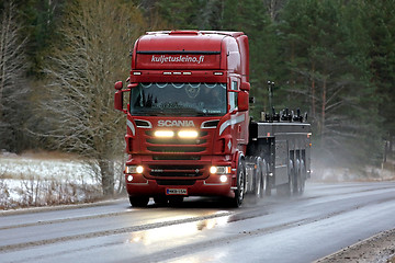 Image showing Red Scania R560 Truck High Beams on Winter Road