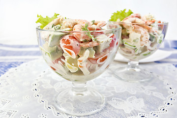 Image showing Salad with shrimp and avocado in glass on white napkin