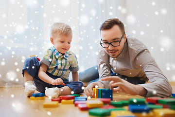 Image showing father and son playing with toy blocks at home