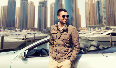 Image showing happy man near cabriolet car on city 