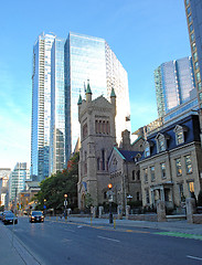 Image showing High rise with old church.