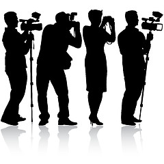 Image showing Cameraman with video camera. Silhouettes on white background. 