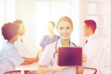 Image showing happy doctor over group of medics at hospital