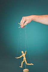 Image showing Image puppet in the hands of the puppeteer