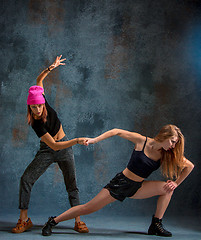 Image showing The two attractive girls dancing twerk in the studio