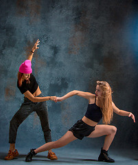 Image showing The two attractive girls dancing twerk in the studio