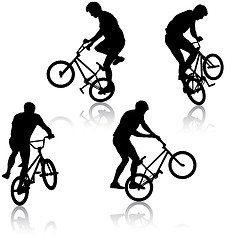 Image showing Set silhouette of a cyclist male performing acrobatic pirouettes. illustration