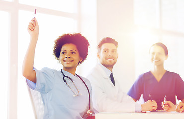 Image showing group of happy doctors on conference at hospital