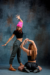 Image showing The two attractive girls dancing twerk in the studio