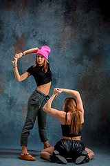 Image showing The two attractive girls dancing twerk in the studio